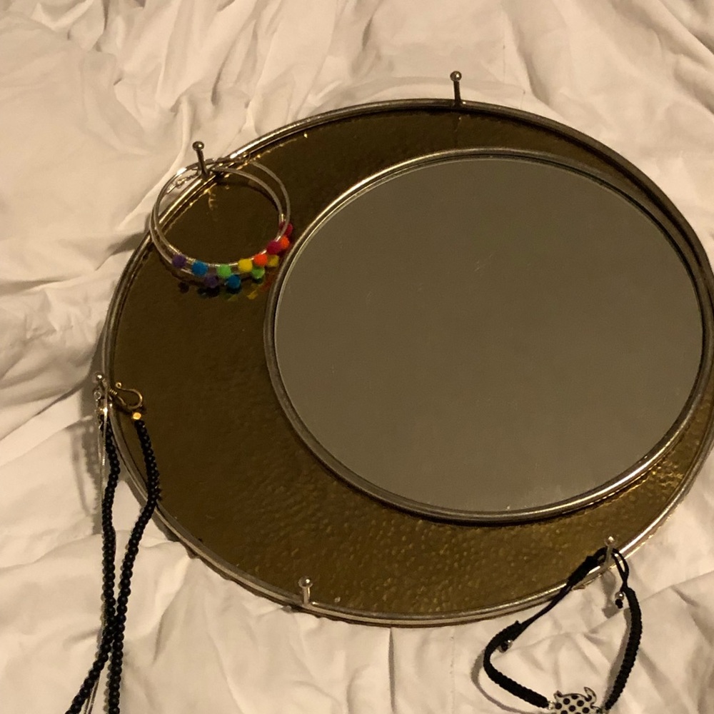 Hanging mirror with hooks